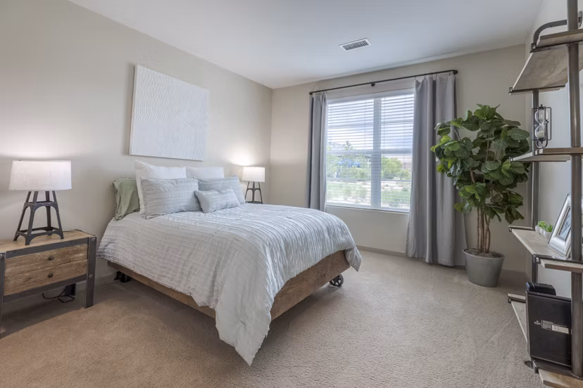 Cozy bedroom featuring contemporary decor at Outlook Littleton Apartments