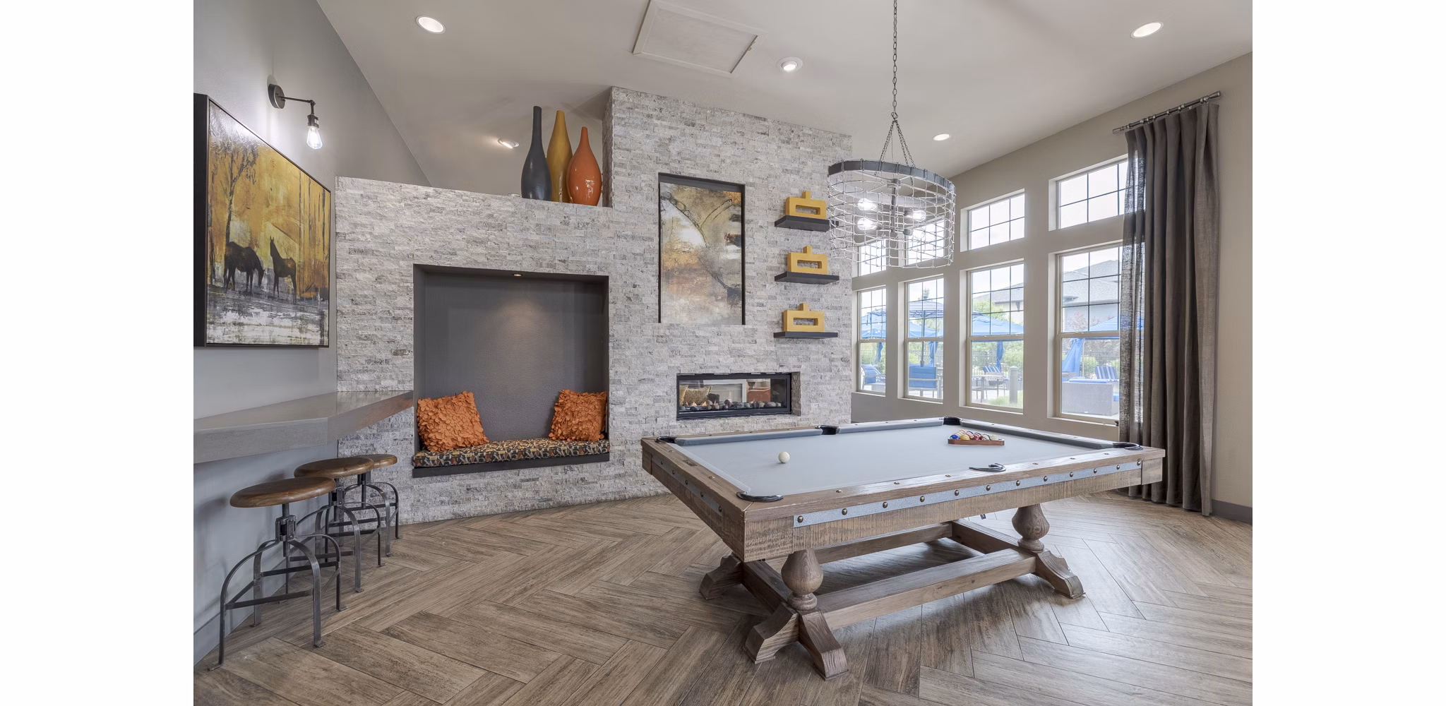 Clubhouse featuring modern design and entertainment areas at Outlook Littleton Apartments in Littleton