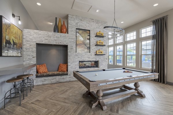 Clubhouse featuring modern design and entertainment areas at Outlook Littleton Apartments in Littleton