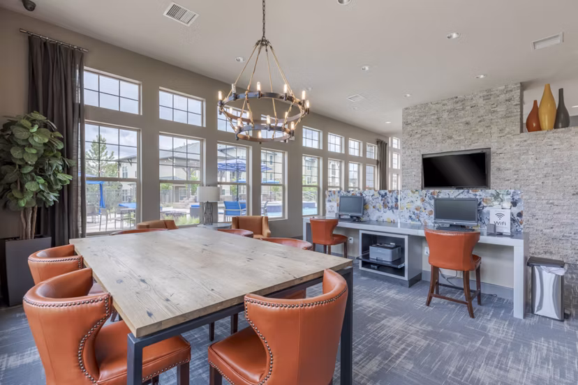 Clubhouse with modern seating and entertainment options at Outlook Littleton Apartments