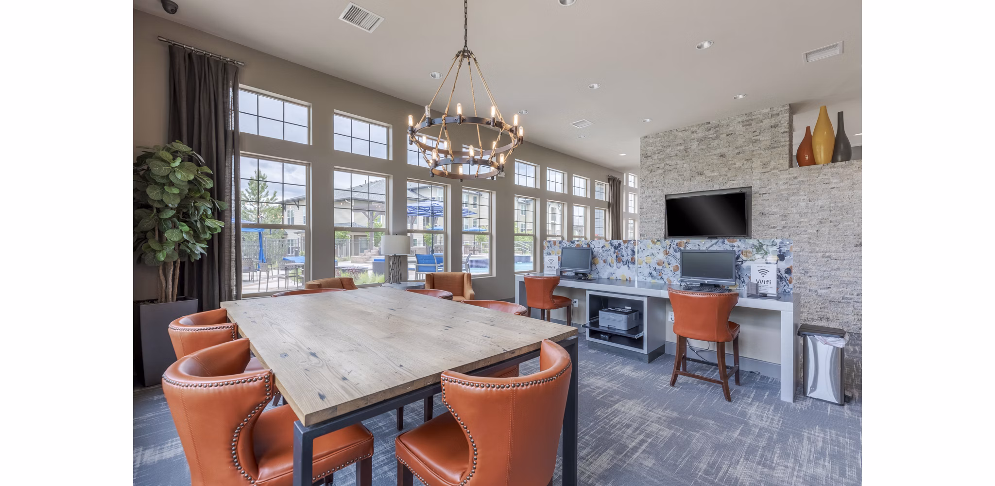 Clubhouse with modern seating and entertainment options at Outlook Littleton Apartments