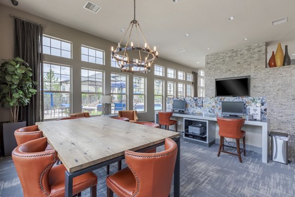 Clubhouse with modern seating and entertainment options at Outlook Littleton Apartments