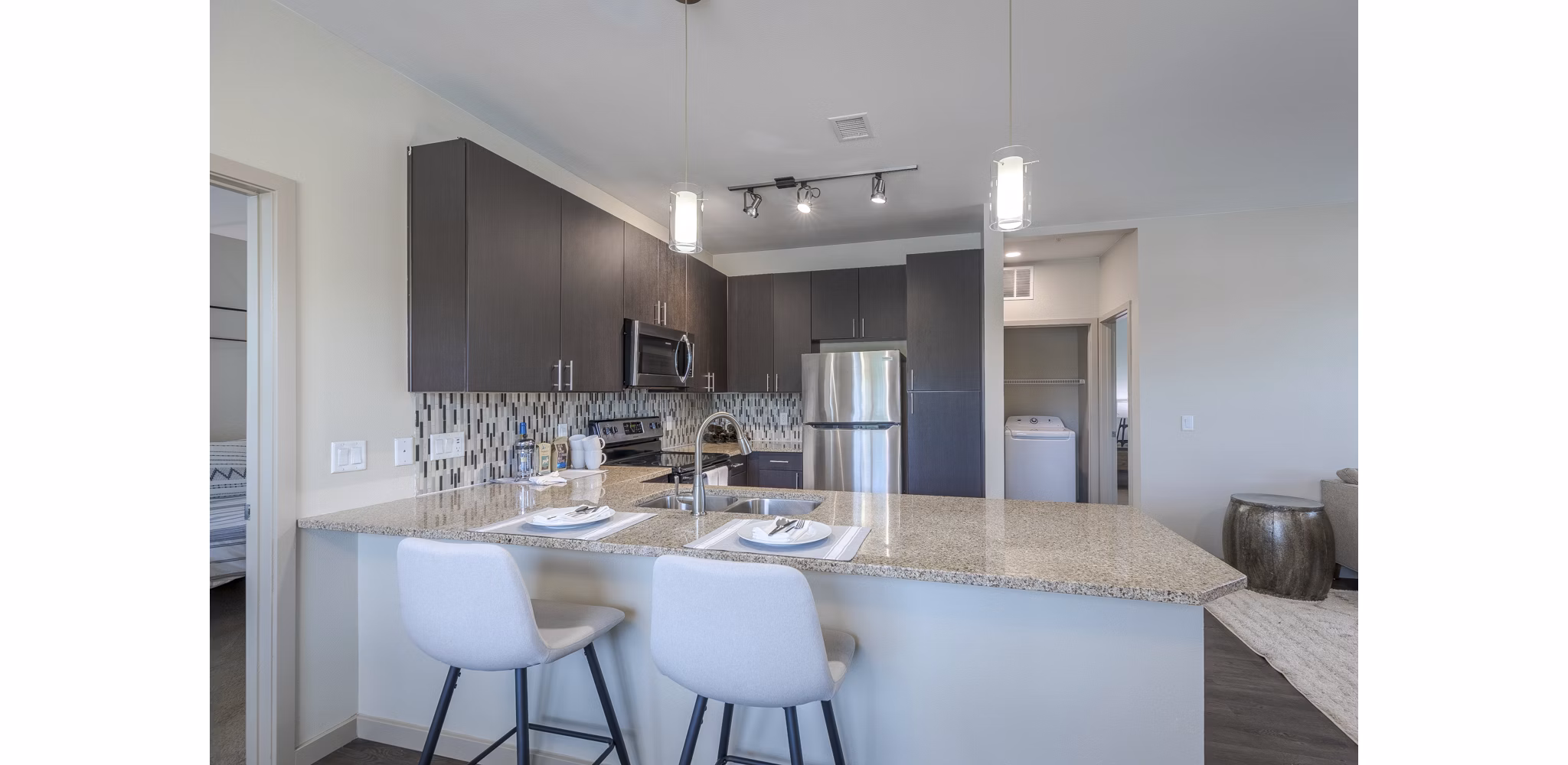 Modern kitchen with stainless steel appliances in Outlook Littleton Apartments