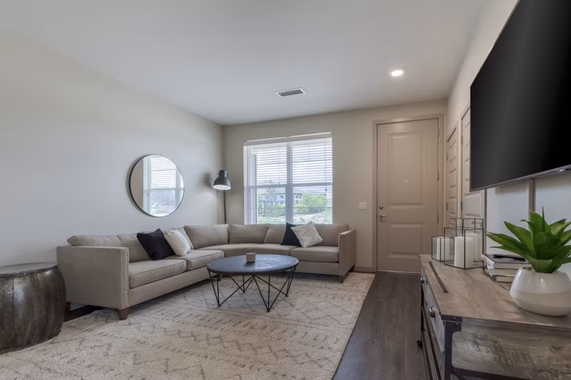Spacious living room with modern furnishings at Outlook Littleton Apartments