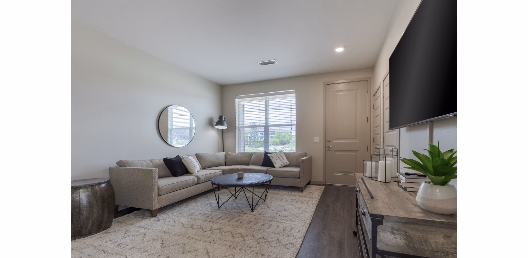 Spacious living room with modern furnishings at Outlook Littleton Apartments