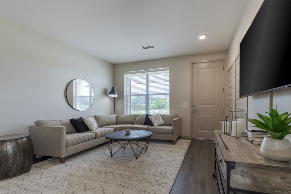Spacious living room with modern furnishings at Outlook Littleton Apartments
