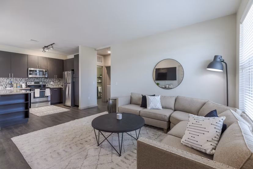 Living room with modern furniture and natural light at Outlook Littleton Apartments