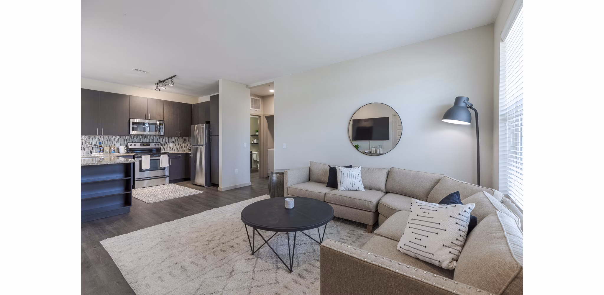 Living room with modern furniture and natural light at Outlook Littleton Apartments