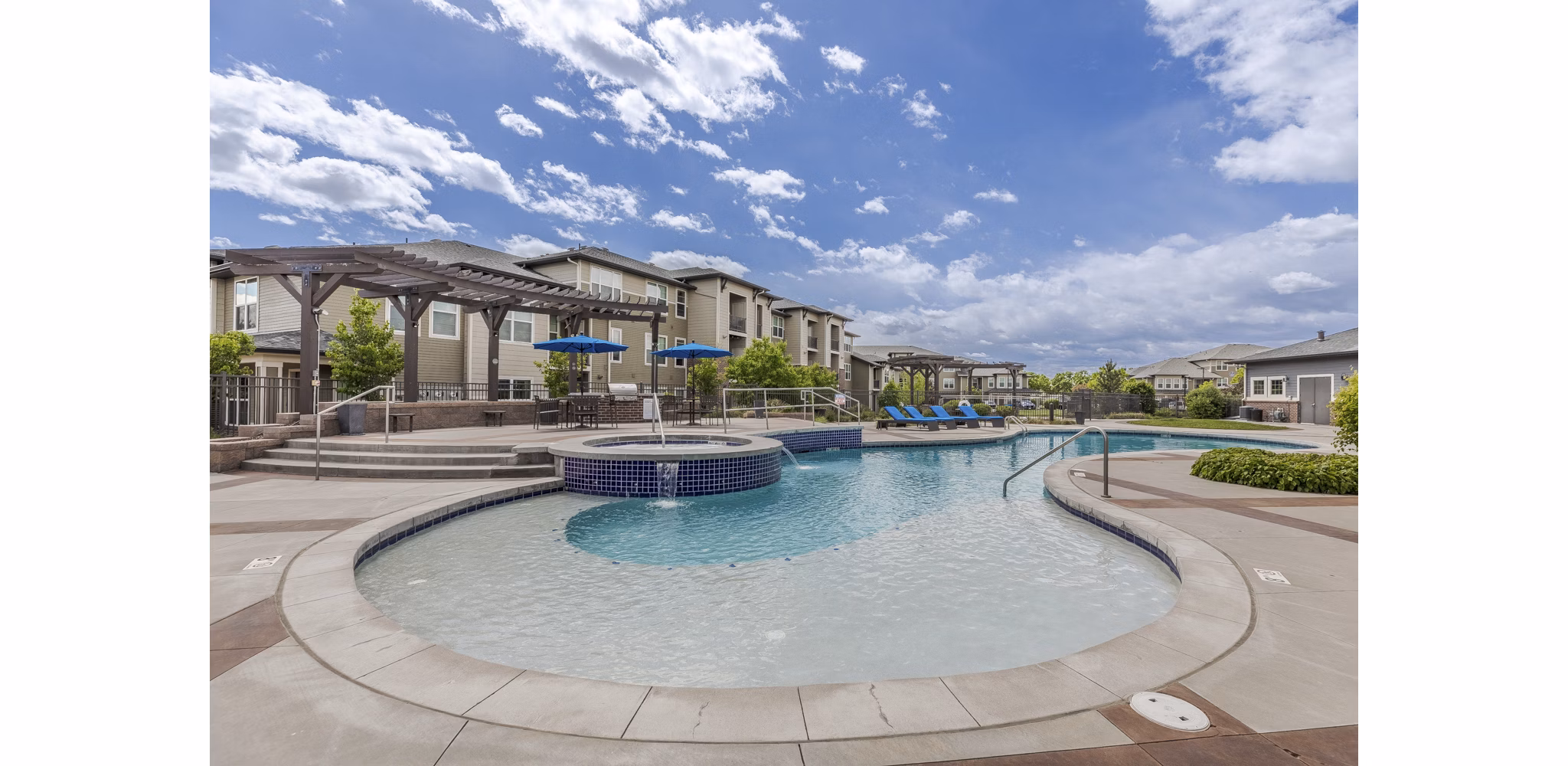 Sunlit pool area at Outlook Littleton Apartments offering luxury living in a vibrant community setting