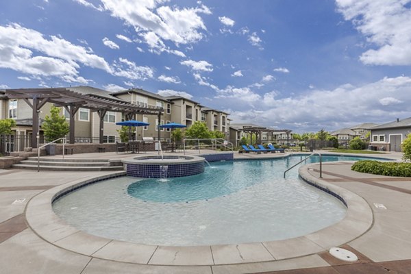 Sunlit pool area at Outlook Littleton Apartments offering luxury living in a vibrant community setting