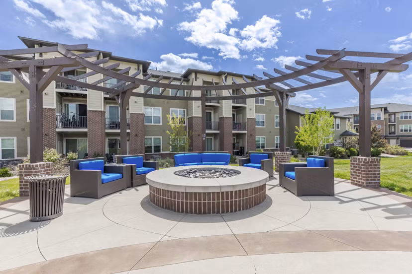 Cozy fire pit area at Outlook Littleton Apartments, perfect for relaxation and social gatherings, showcasing luxury living
