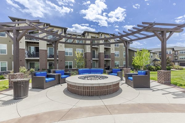 Cozy fire pit area at Outlook Littleton Apartments, perfect for relaxation and social gatherings, showcasing luxury living