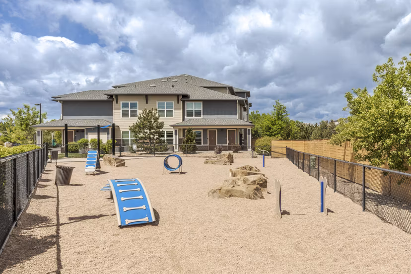 Dog park featuring agility equipment at Outlook Littleton Apartments
