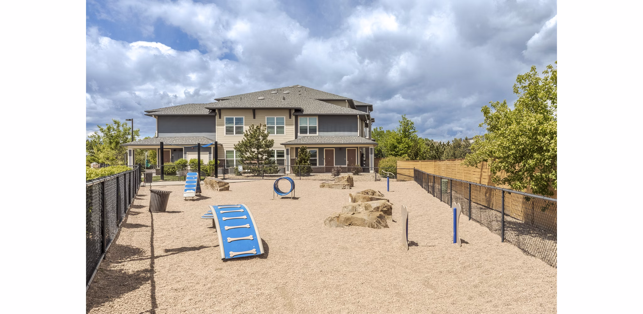 Dog park featuring agility equipment at Outlook Littleton Apartments