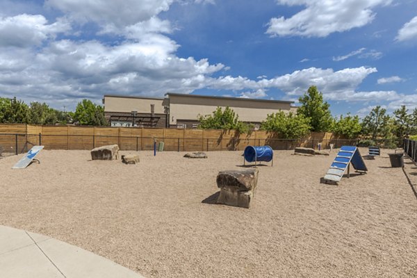 Dog park featuring agility equipment at Outlook Littleton Apartments, perfect for pet-friendly living
