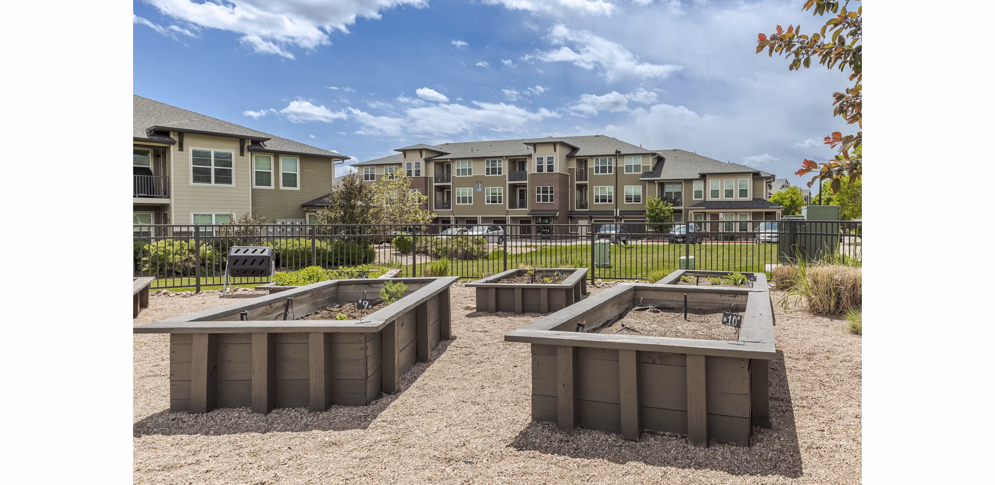 Courtyard at Outlook Littleton Apartments featuring lush greenery and outdoor seating areas