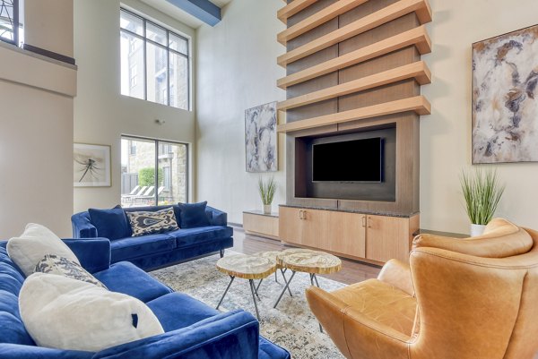 Modern clubhouse with pool table and seating at Artessa at Quarry Village Apartments, offering luxury amenities in a vibrant community