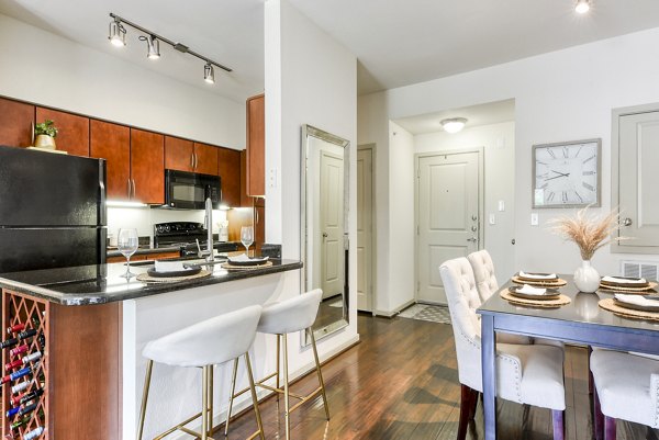 Dining room with elegant design and modern furniture in Artessa at Quarry Village Apartments