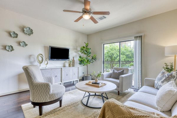 Spacious living room with modern decor at Artessa at Quarry Village Apartments