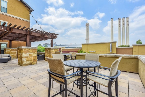 Cozy patio with seating area at Artessa at Quarry Village Apartments