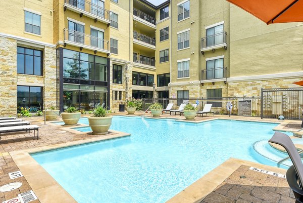 Elegant pool area at Artessa at Quarry Village Apartments offering luxury relaxation in a serene setting