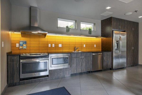 Modern clubhouse with cozy seating and entertainment space at The Luke Apartments, offering luxury living experiences