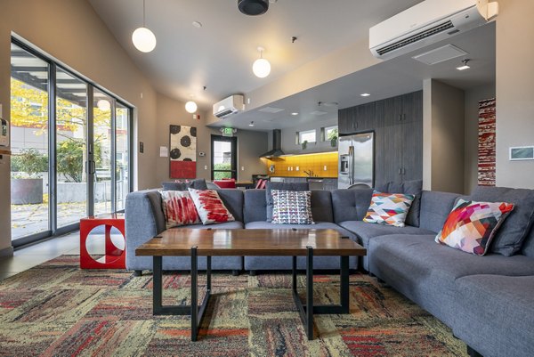 Clubhouse with modern design and lounge seating at The Luke Apartments, offering luxury amenities for residents