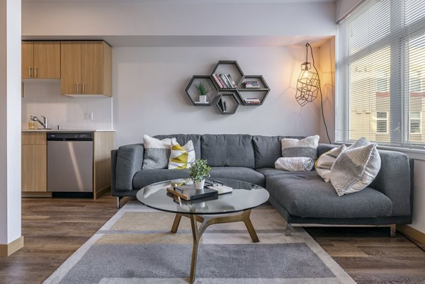 Spacious living room with stylish furnishings at The Luke Apartments