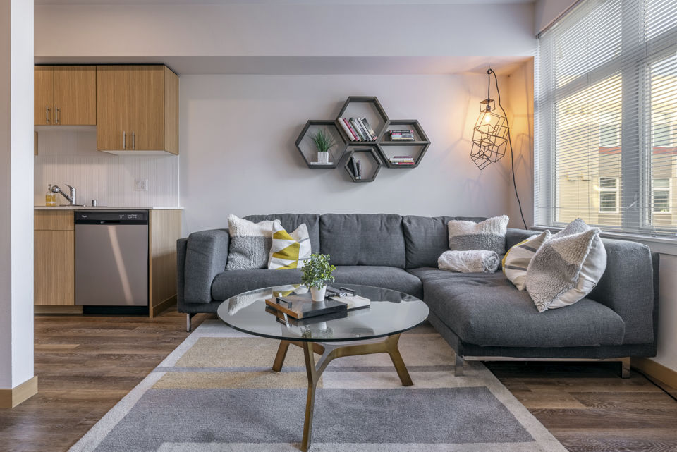 Spacious living room with stylish furnishings at The Luke Apartments