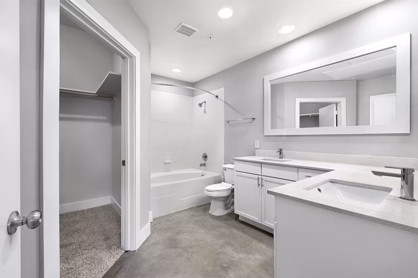 Modern bathroom with marble countertops at Residences at the Triangle Apartments