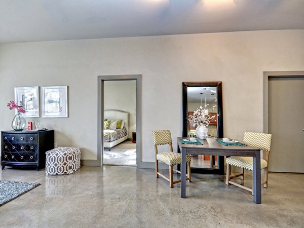 Stylish dining area with modern table and chairs, reflecting a chic bedroom design