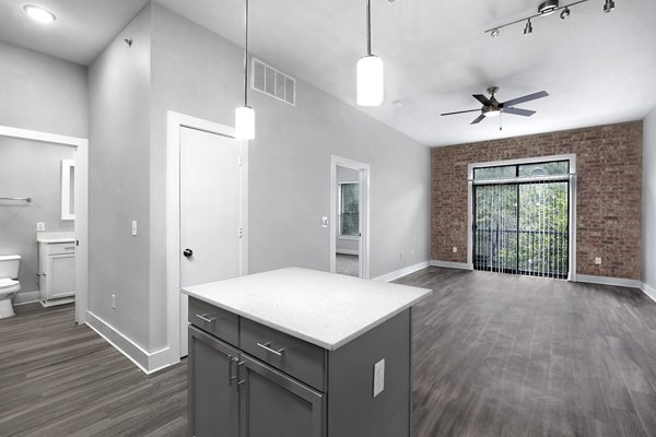 Contemporary kitchen with stainless steel appliances at Residences at the Triangle Apartments