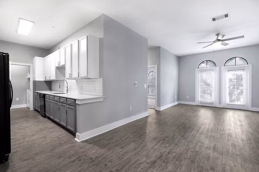 Modern kitchen with stainless steel appliances in Residences at the Triangle Apartments