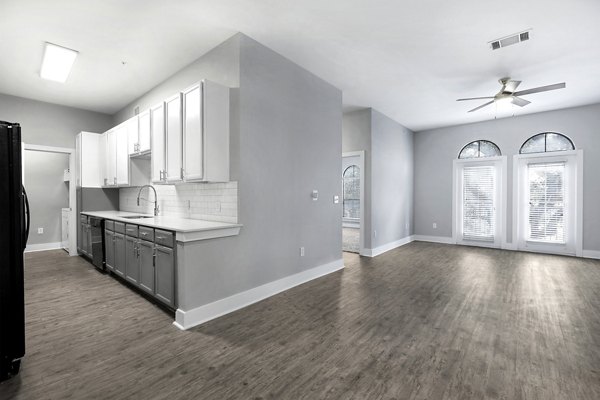 Modern kitchen with stainless steel appliances in Residences at the Triangle Apartments