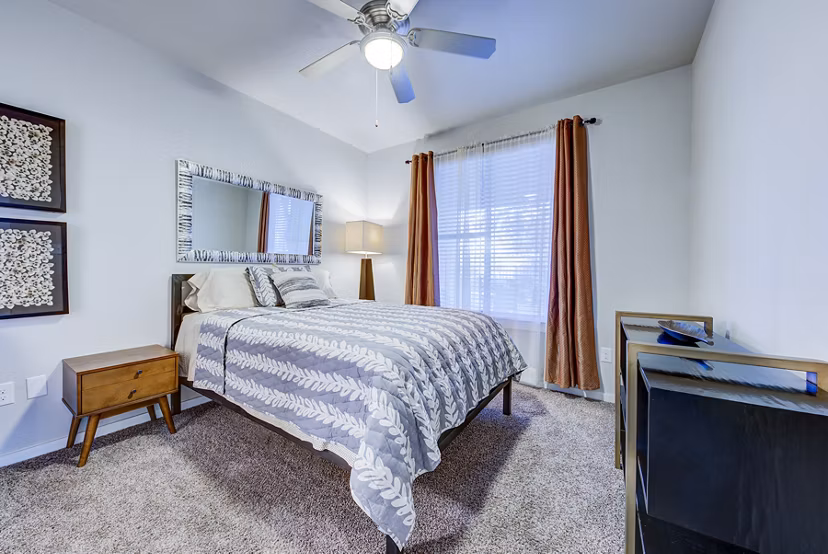 Luxurious bedroom with modern decor at Boardwalk Research Luxury Apartments