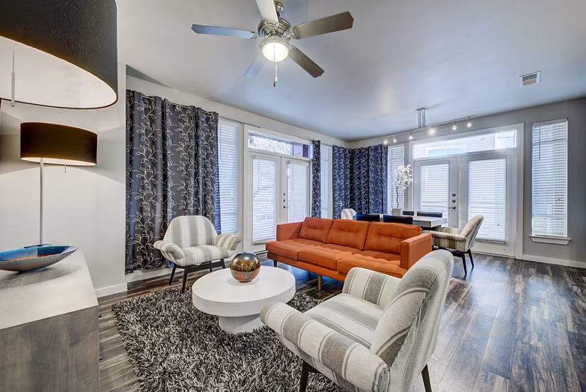 Spacious living room with modern decor in Boardwalk Research Luxury Apartments