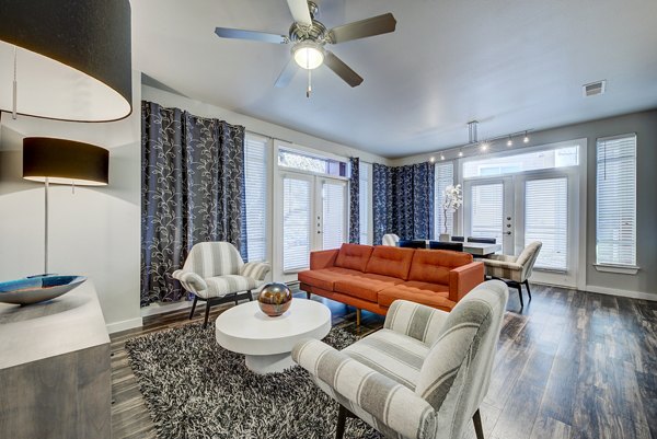 Spacious living room with modern decor in Boardwalk Research Luxury Apartments
