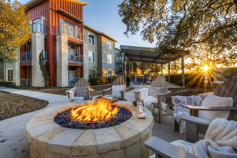 Cozy fire pit area at Boardwalk Research Luxury Apartments, ideal for outdoor relaxation and socializing