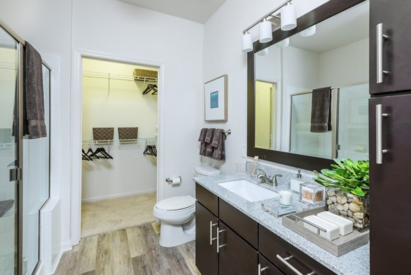 Luxurious bathroom with marble countertops at 1100 South Apartments