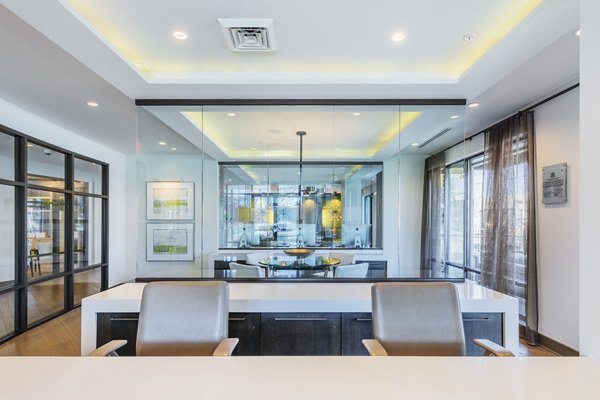 Elegant clubhouse with modern decor at 1100 South Apartments, perfect for social gatherings and relaxation Luxury amenities in a vibrant community setting