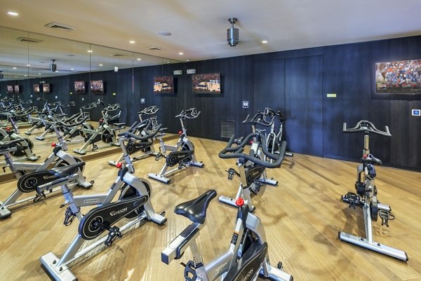 Yoga and spin studio with modern fitness equipment at 1100 South Apartments