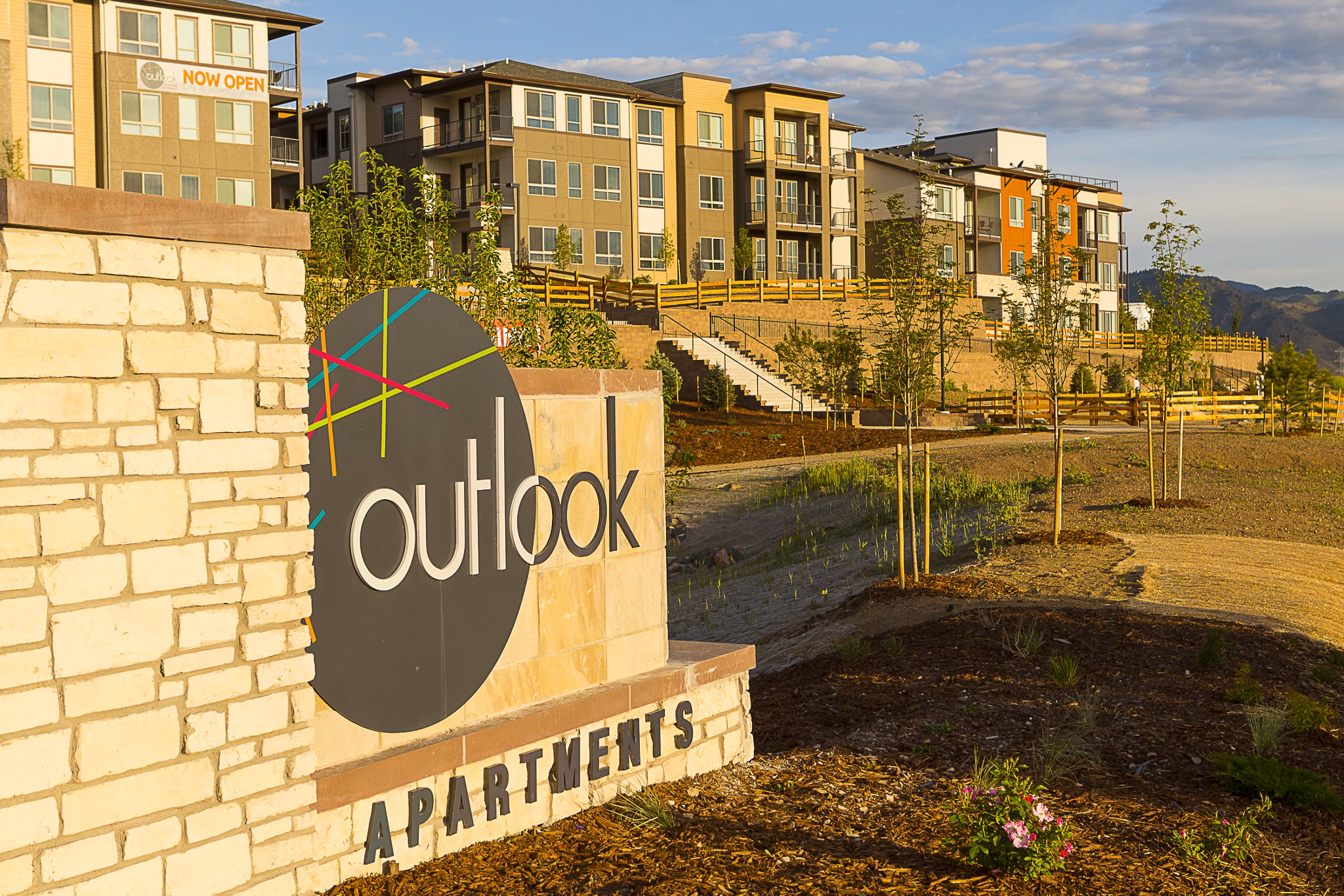 Outlook Golden Ridge Apartments signage against a clear blue sky
