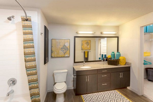 Modern bathroom with sleek fixtures and granite countertops at Outlook Golden Ridge Apartments, offering luxury living near Denver