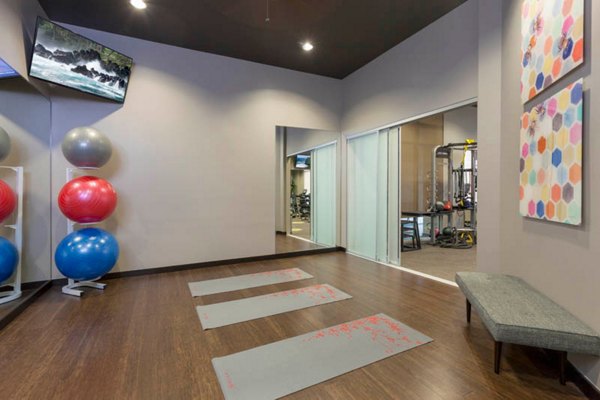 State-of-the-art fitness center with modern equipment at Outlook Golden Ridge Apartments in Golden, featuring a spacious workout area for residents