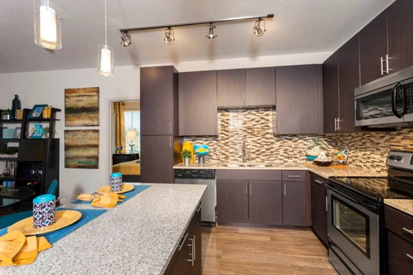 Modern kitchen with stainless steel appliances at Outlook Golden Ridge Apartments