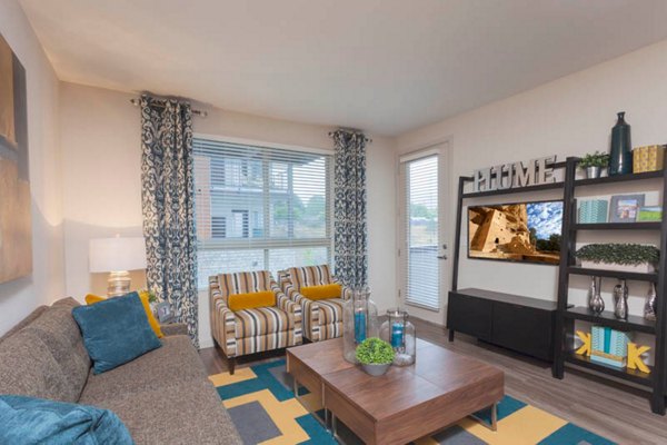 Outlook Golden Ridge Apartments: Cozy living room with modern dÃ©cor and natural light, perfect for relaxation and comfort