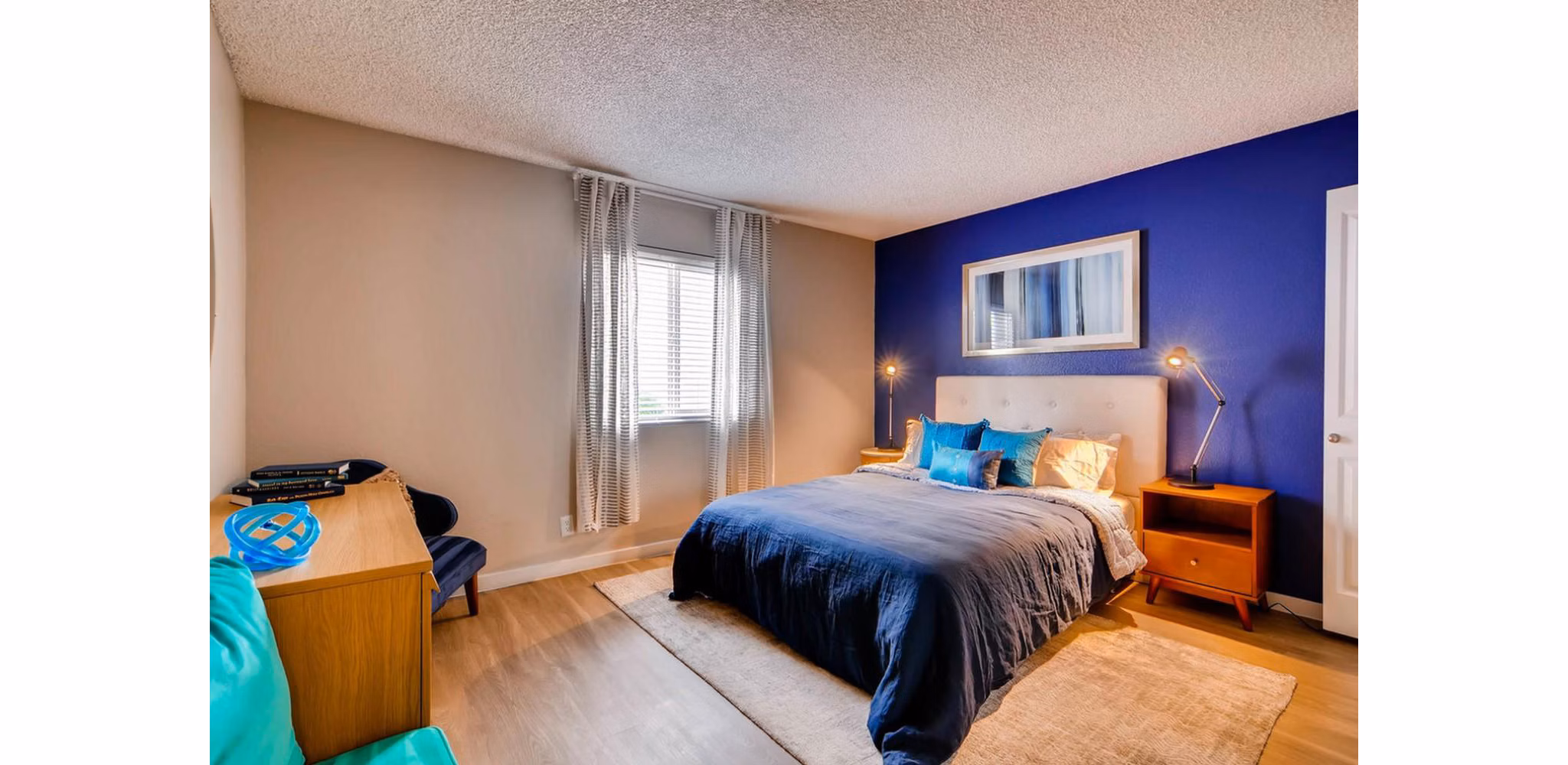 The Cortesian Apartments: Cozy bedroom with modern dÃ©cor and ample natural light in Scottsdale