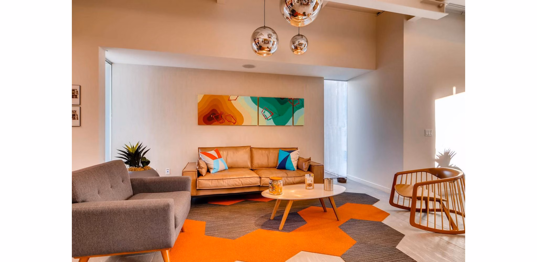 Clubhouse with elegant seating and modern decor at The Cortesian Apartments, ideal for luxury living by Greystar