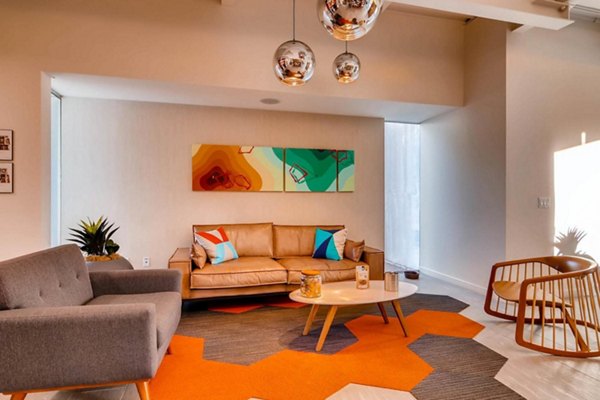 Clubhouse with elegant seating and modern decor at The Cortesian Apartments, ideal for luxury living by Greystar