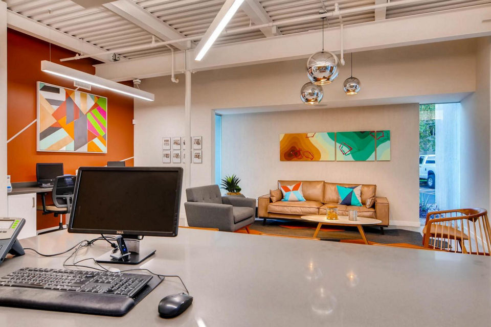 Clubhouse with modern interior design at The Cortesian Apartments, a luxury Greystar community